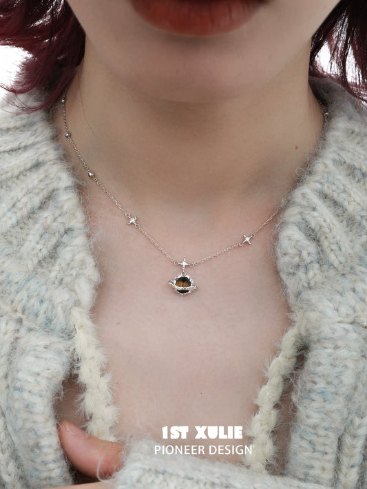 1STXULIE desert planet necklace with star accents and a unique gemstone centerpiece
