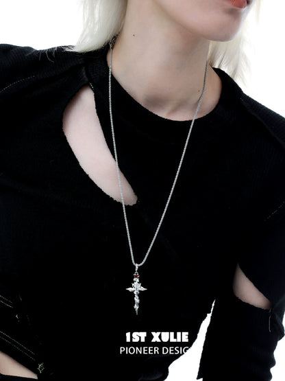 Stylish model wearing a diablo rose cross necklace featuring intricate detailing and a silver finish