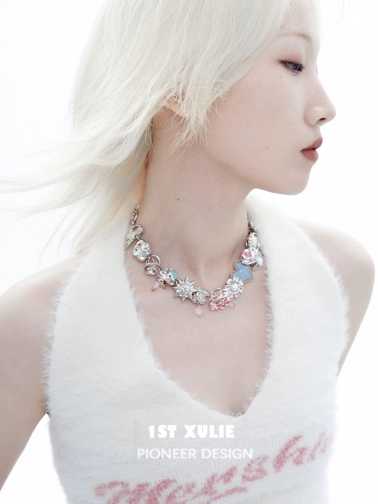 Dopamine choker necklace with colorful charms and sparkling details, worn by a model