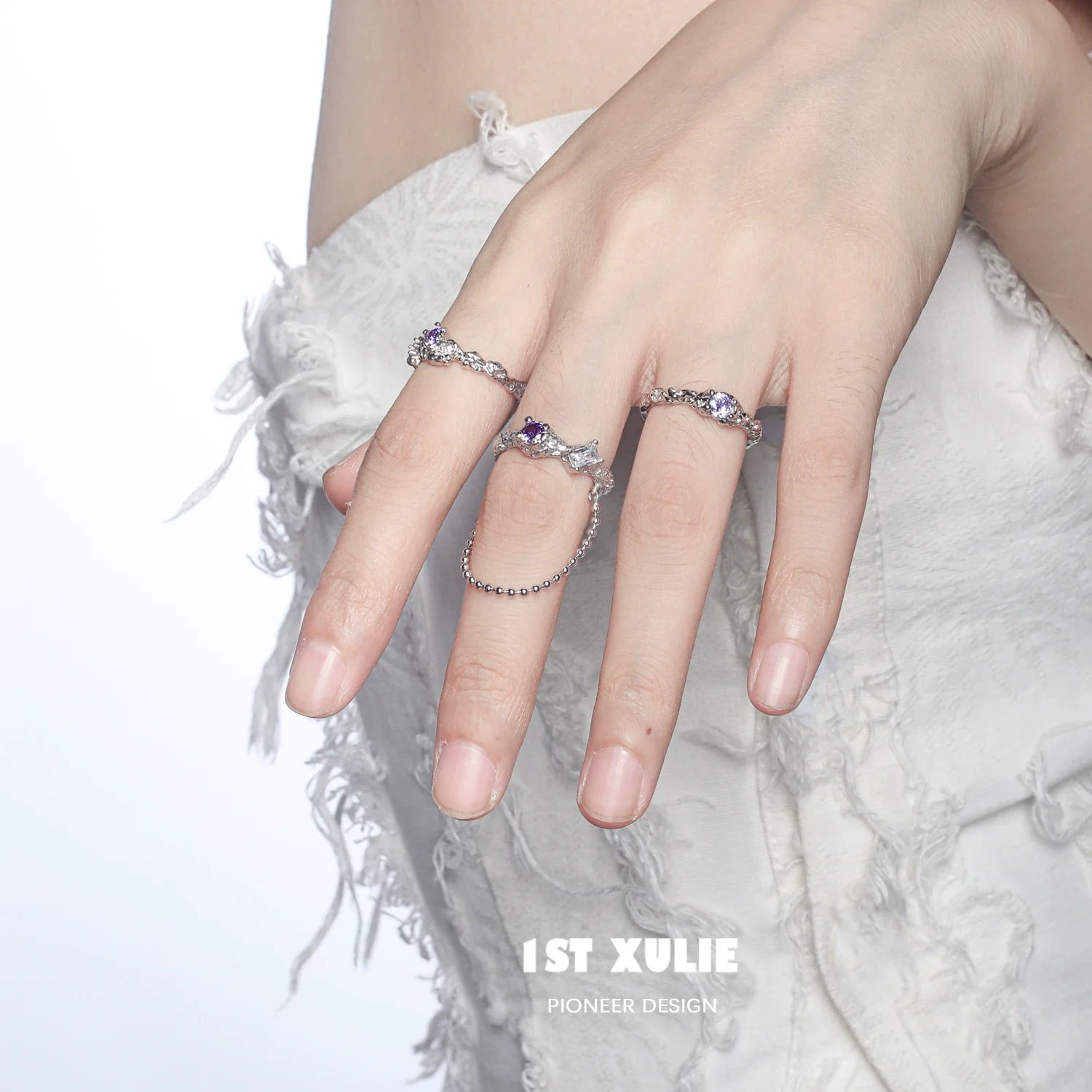 Woman wearing the dream fairy purple zircon ring showcasing intricate design and sparkling stones