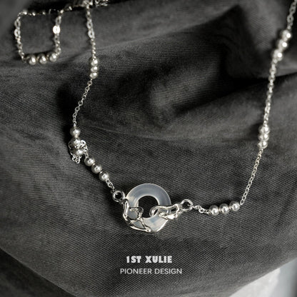 Elegant eternal rings silver necklace by 1STXULIE featuring a unique design with beads and a circular pendant