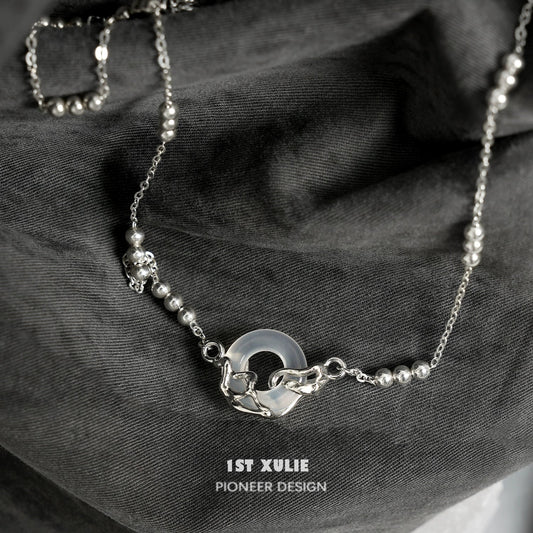 Elegant eternal rings silver necklace by 1STXULIE featuring a unique design with beads and a circular pendant