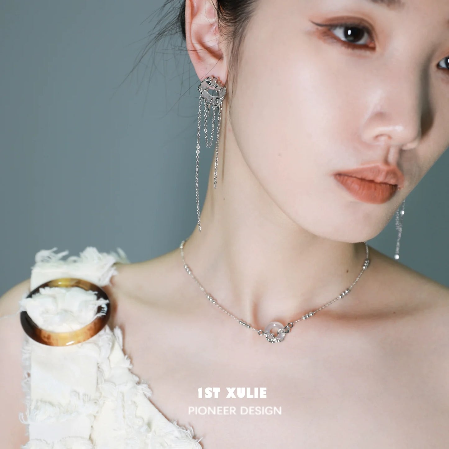 Model wearing an elegant eternal rings silver necklace with unique design for a modern look