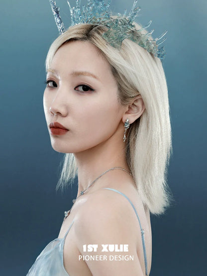 Elegant model showcasing fantasy dragon earrings with intricate design and shimmering details