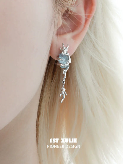 Silver fantasy dragon earrings with unique design, perfect for fantasy lovers and accessory enthusiasts