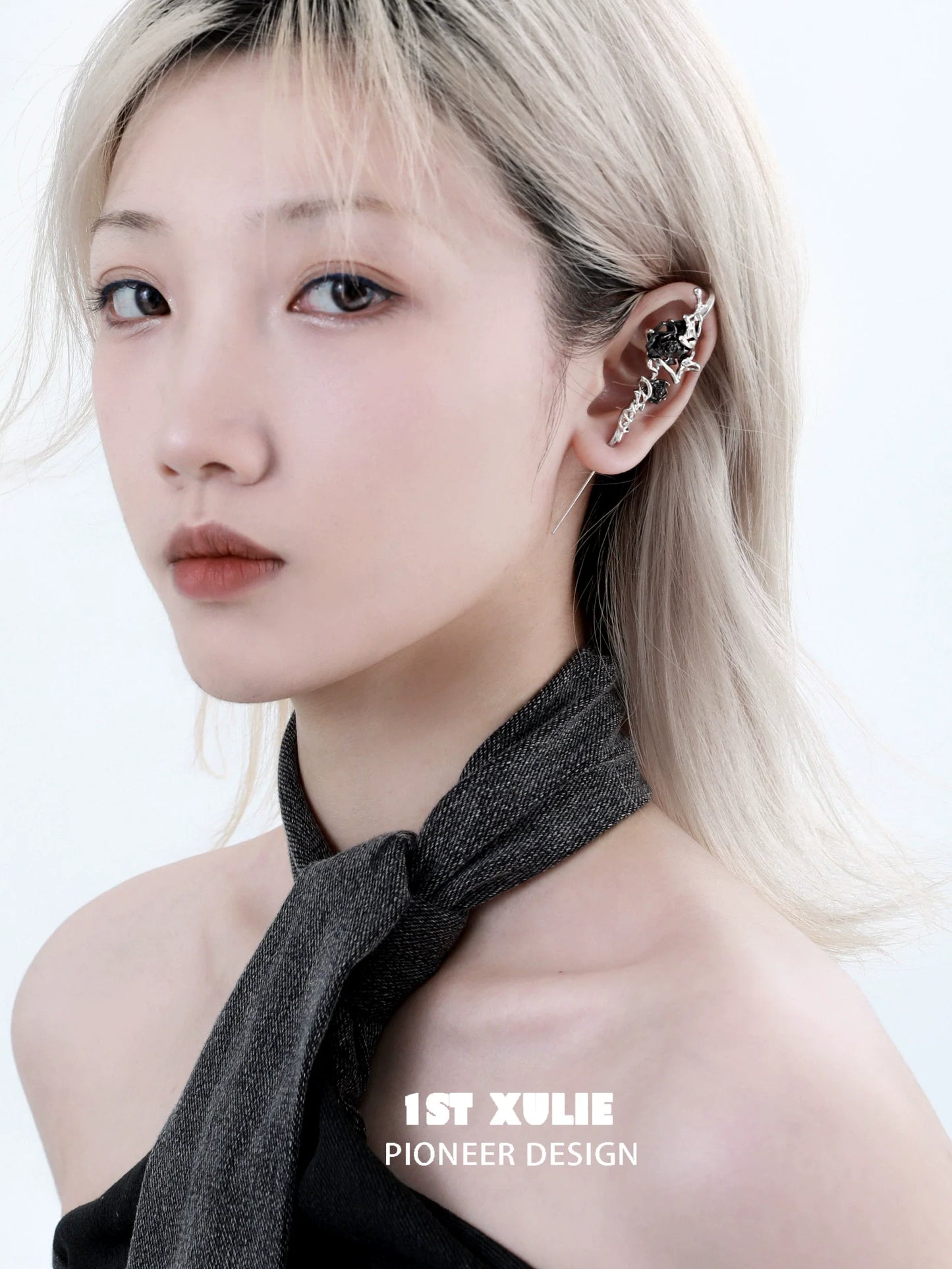 Model showcasing the forbidden rose ear piercing needle in a stylish look with elegant detail