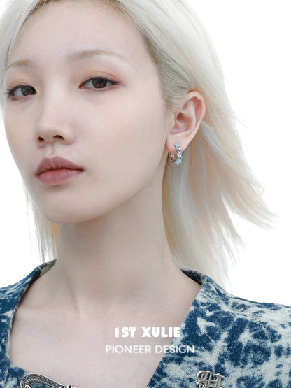 Model wearing frozen blue crystal ear cuffs designed by 1ST XULIE for a unique look