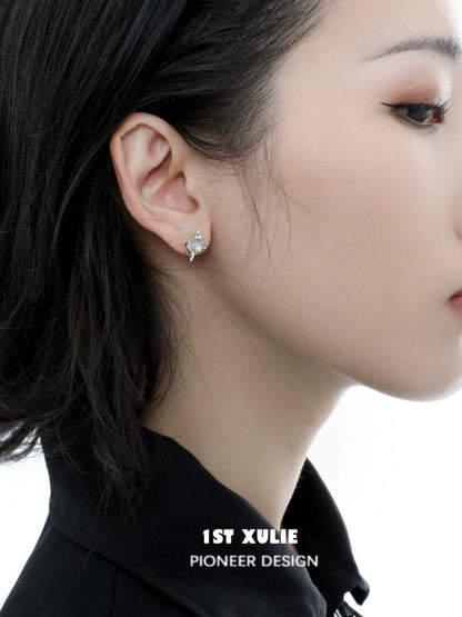 Elegant frozen star agate earrings set against a model's ear, showcasing their unique design and sparkling beauty