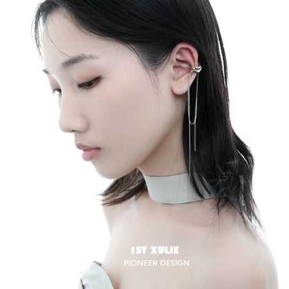 Stylish frozen tassel ear clip design worn by model with a sleek hairstyle