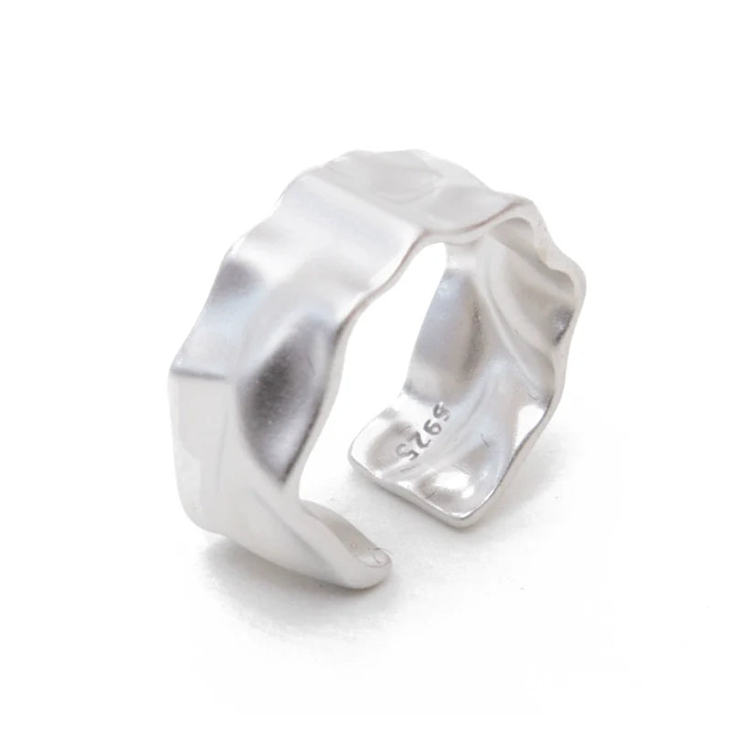 Futuristic silver ring with a unique wave design for modern fashion enthusiasts