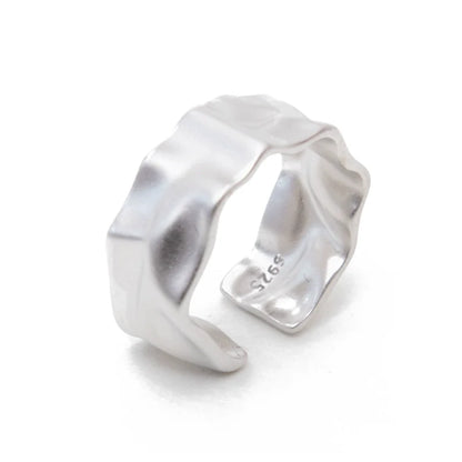Futuristic silver ring with a unique wave design for modern fashion enthusiasts