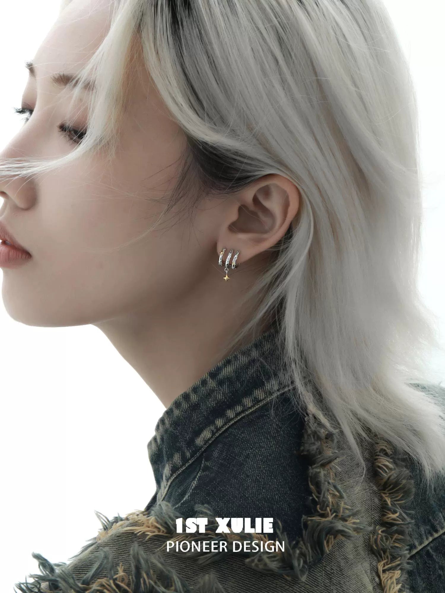 1STXULIE Galactic Star Earrings worn by model with short hair and denim jacket