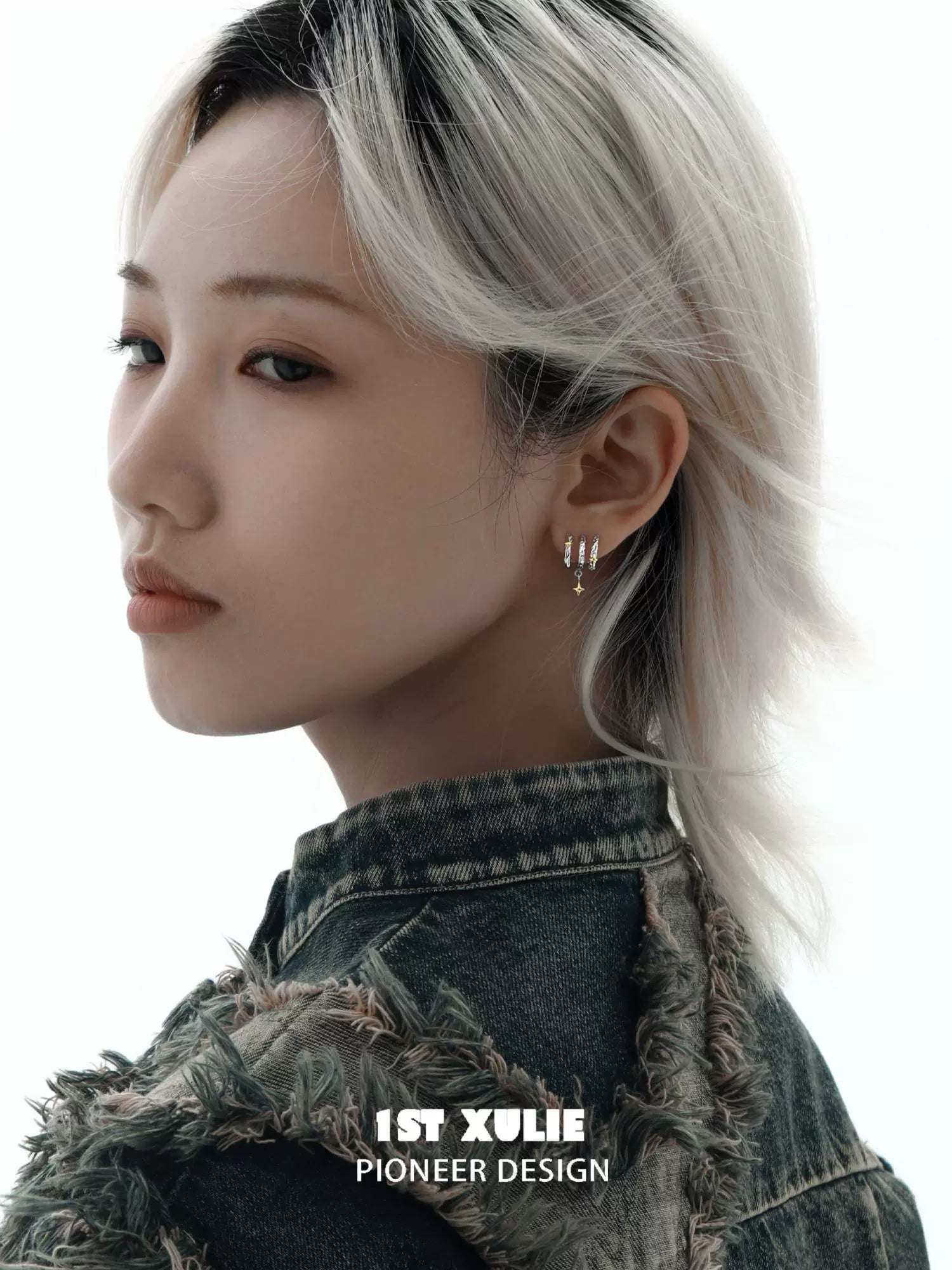 Stylish model showcasing 1ST XULIE galactic star earrings in a modern setting