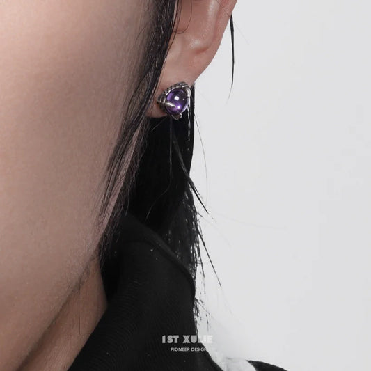 Gothic amethyst stud earrings with a unique design, perfect for a bold fashion statement