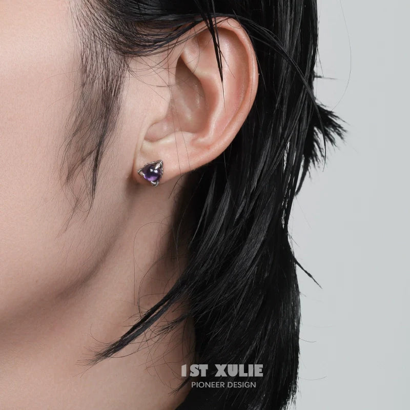 Gothic amethyst stud earrings showcased on a model with short black hair