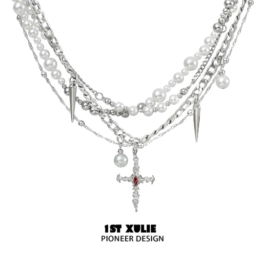 Gothic cross pearl necklace featuring layered strands of pearls and spikes for a unique style