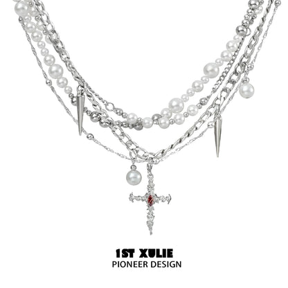 Gothic cross pearl necklace featuring layered strands of pearls and spikes for a unique style
