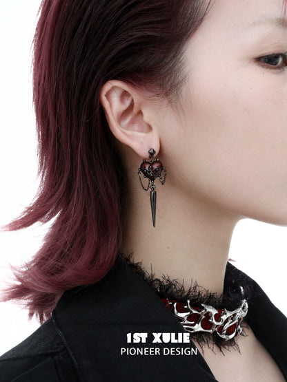 Gothic heart earrings featuring a spider design and dark accents for edgy fashion lovers