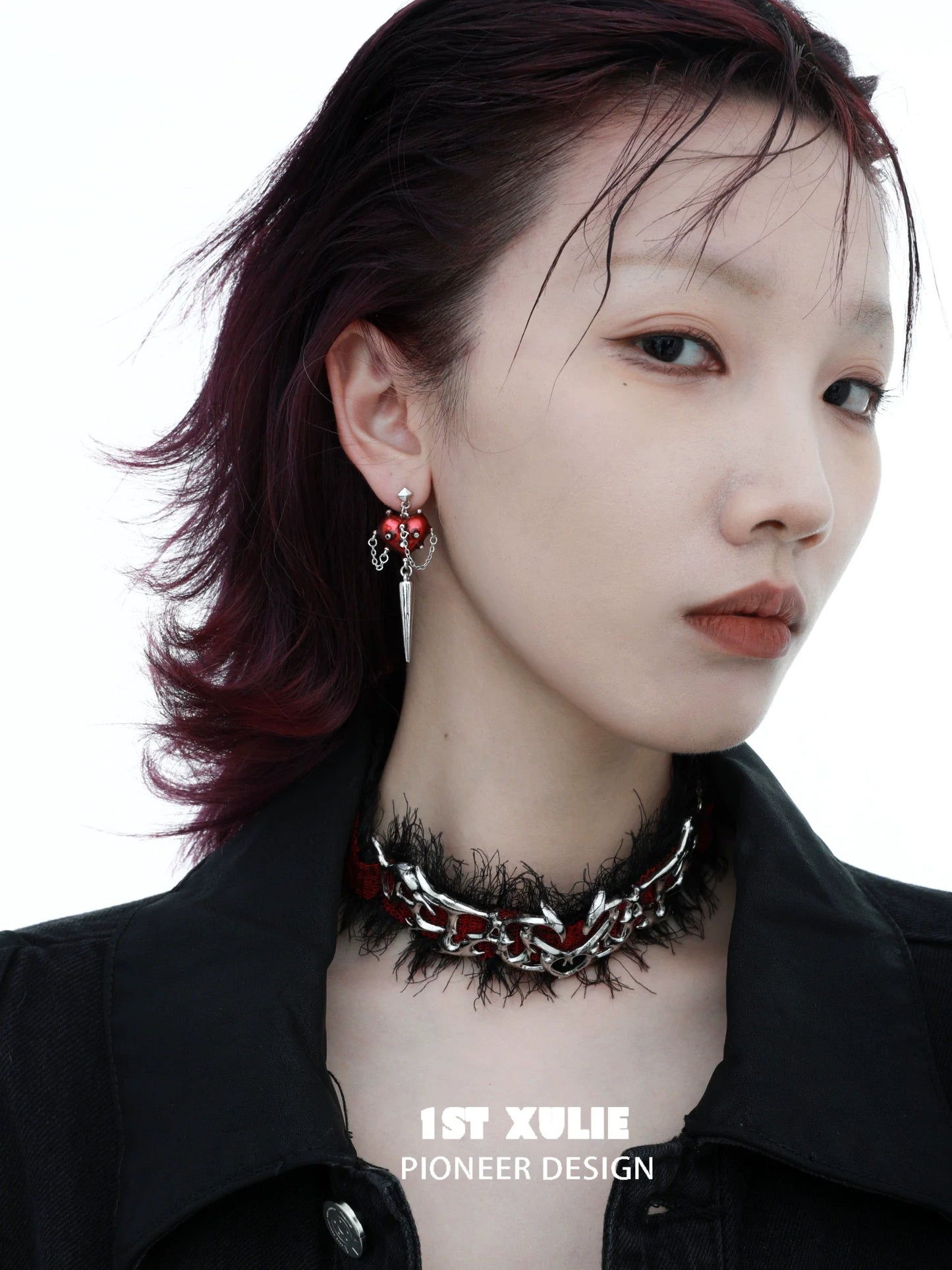 Gothic heart earrings by 1ST XULIE featuring a unique design and striking colors