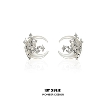 Silver gothic moon earrings featuring a unique celestial design with intricate star details