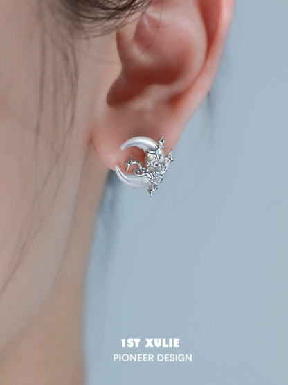 Silver gothic moon earrings featuring a crescent design with intricate detailing for a unique look