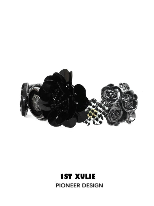Stylish gothic rose bracelet featuring black floral designs and a unique charm