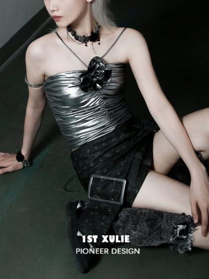 Stylish model wearing a gothic rose clavicle necklace with a metallic top and black skirt for a bold look