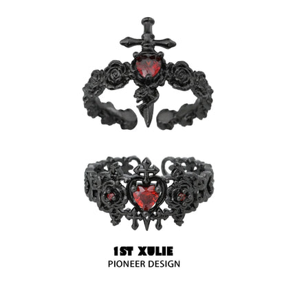 Gothic rose couple rings in black metal featuring red heart gemstones and ornate designs