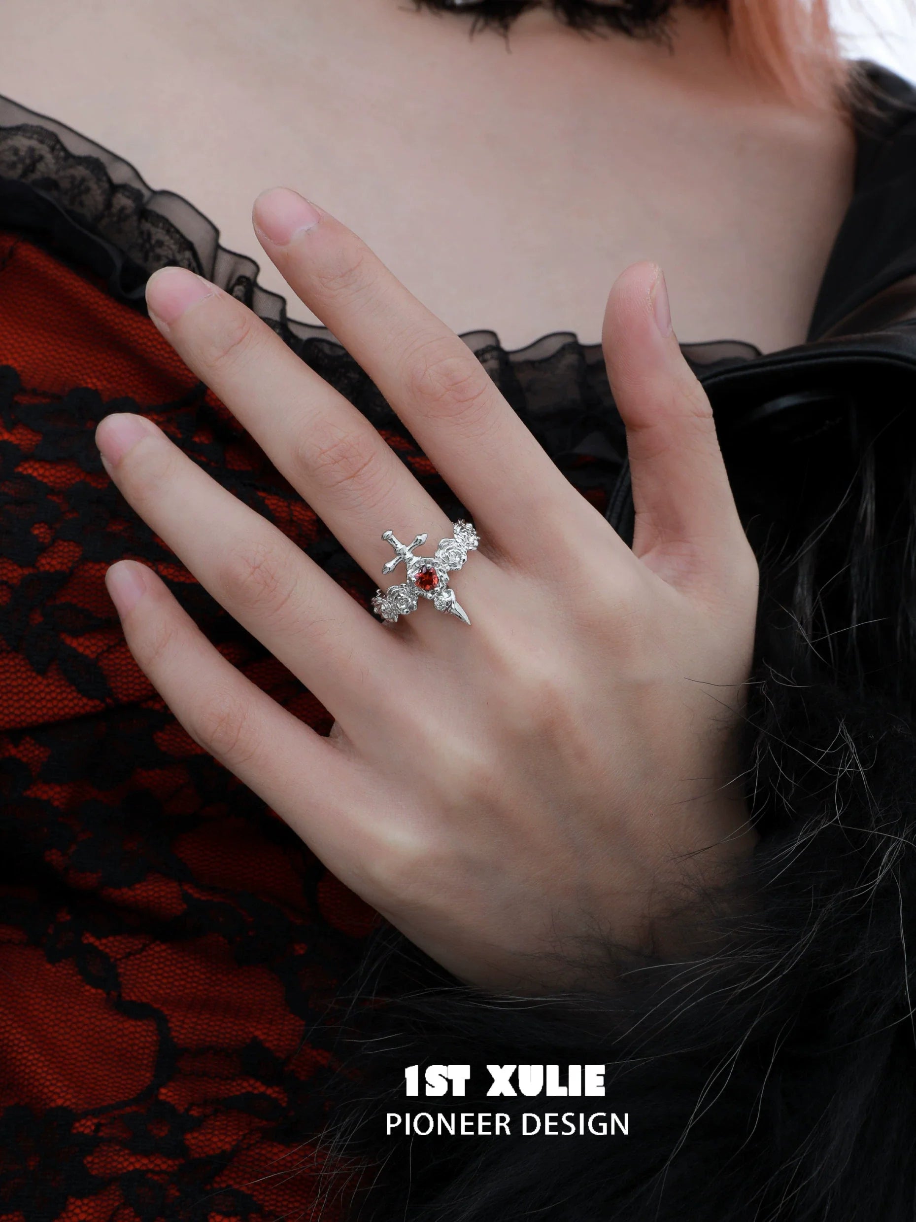 Gothic rose couple rings featuring intricate designs and sparkling elements worn on a hand