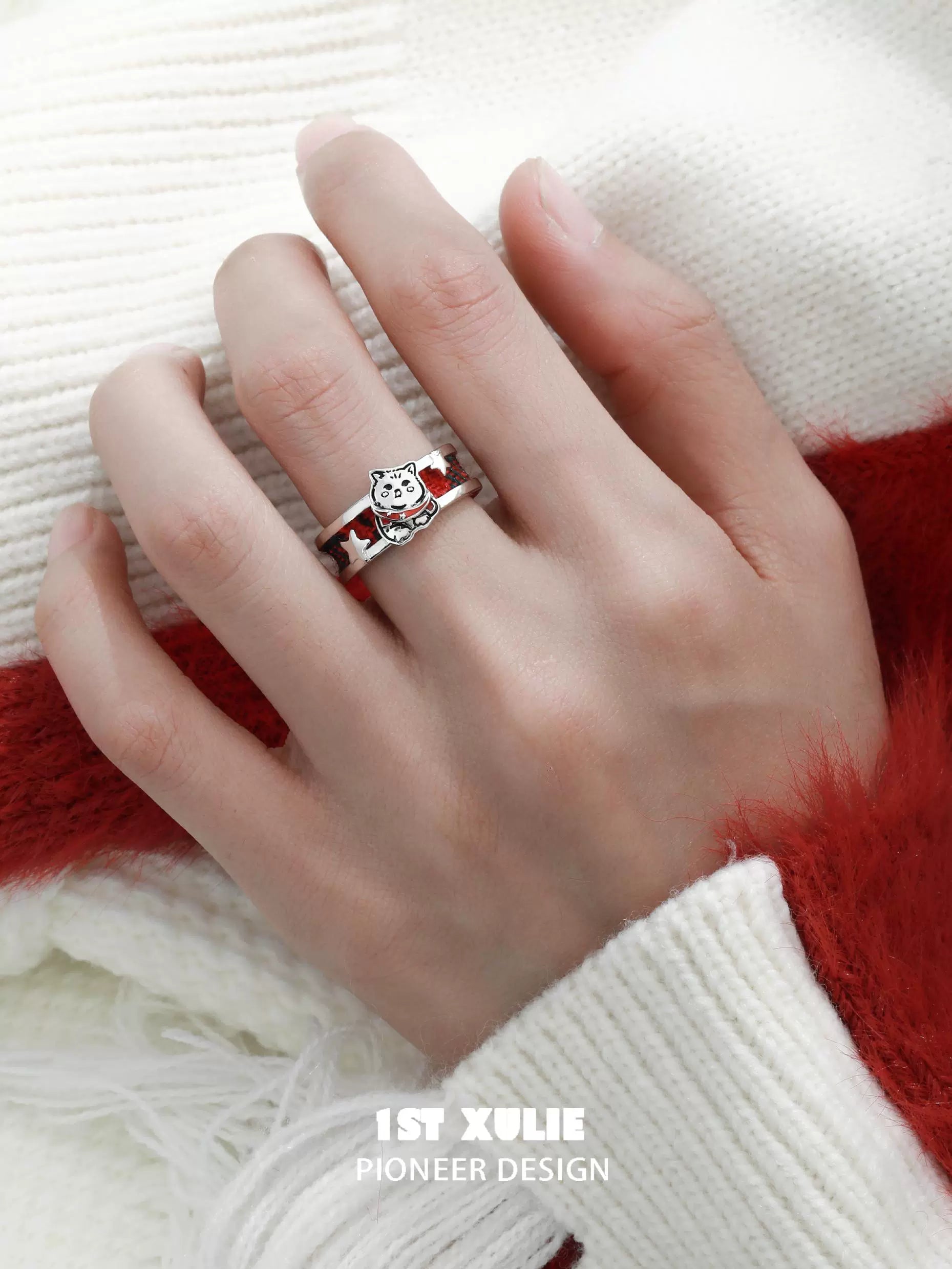 Happy cat dog silver ring featuring a cute design on a stylish hand with a cozy sweater