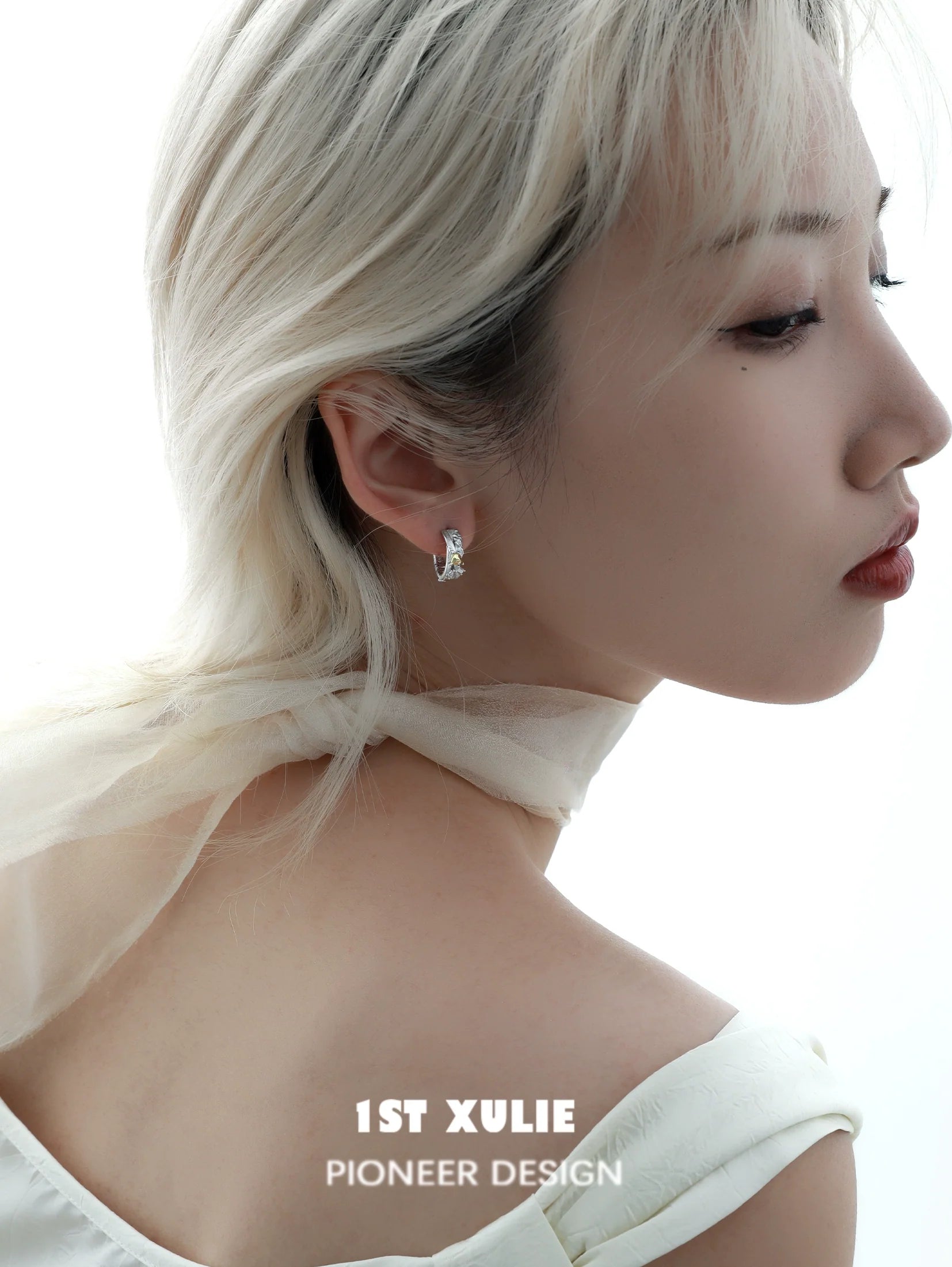 Elegant heart couple earrings from 1ST XULIE showcasing a stylish design worn by a model