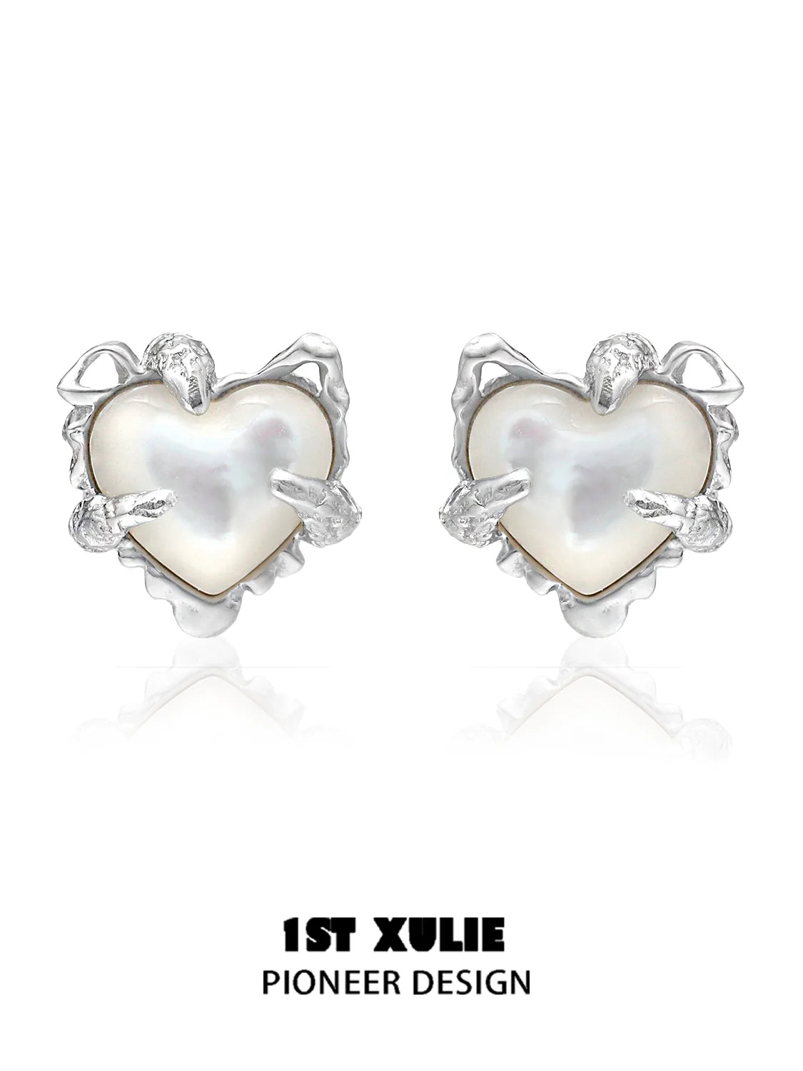 Silver heart ear clips for women with a unique pioneer design featuring a pearl center