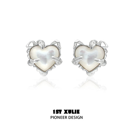 Elegant heart ear clips for women featuring a unique design with pearlescent detail