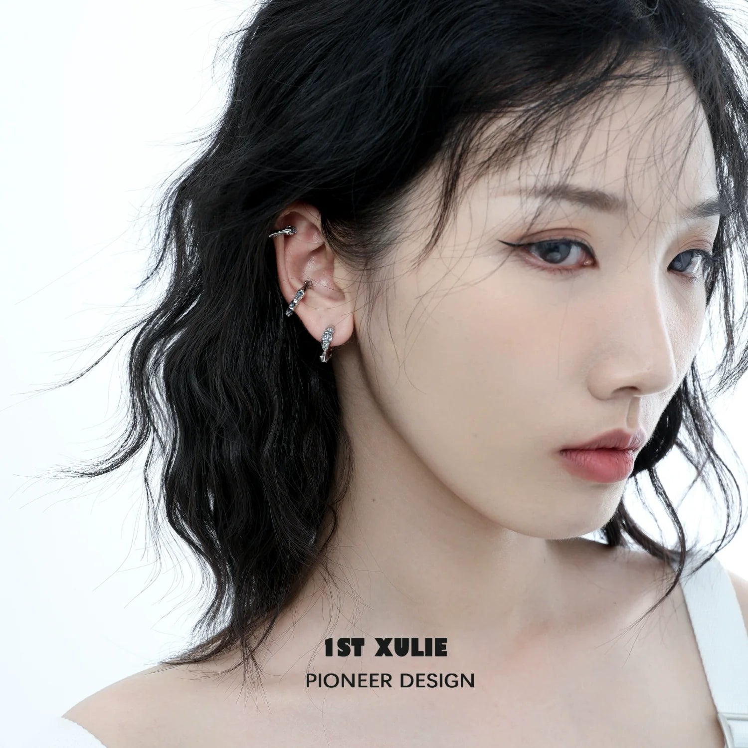 Stylish model wearing Icelandic snowfall earrings that add elegance to any outfit