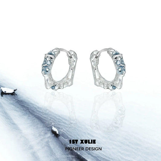 Icelandic snowfall earrings in silver with intricate design, reflecting icy textures and winter elegance