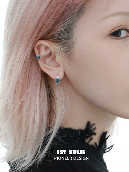 Icelandic zircon ear cuffs showcased on a model with pastel hair, highlighting elegant design