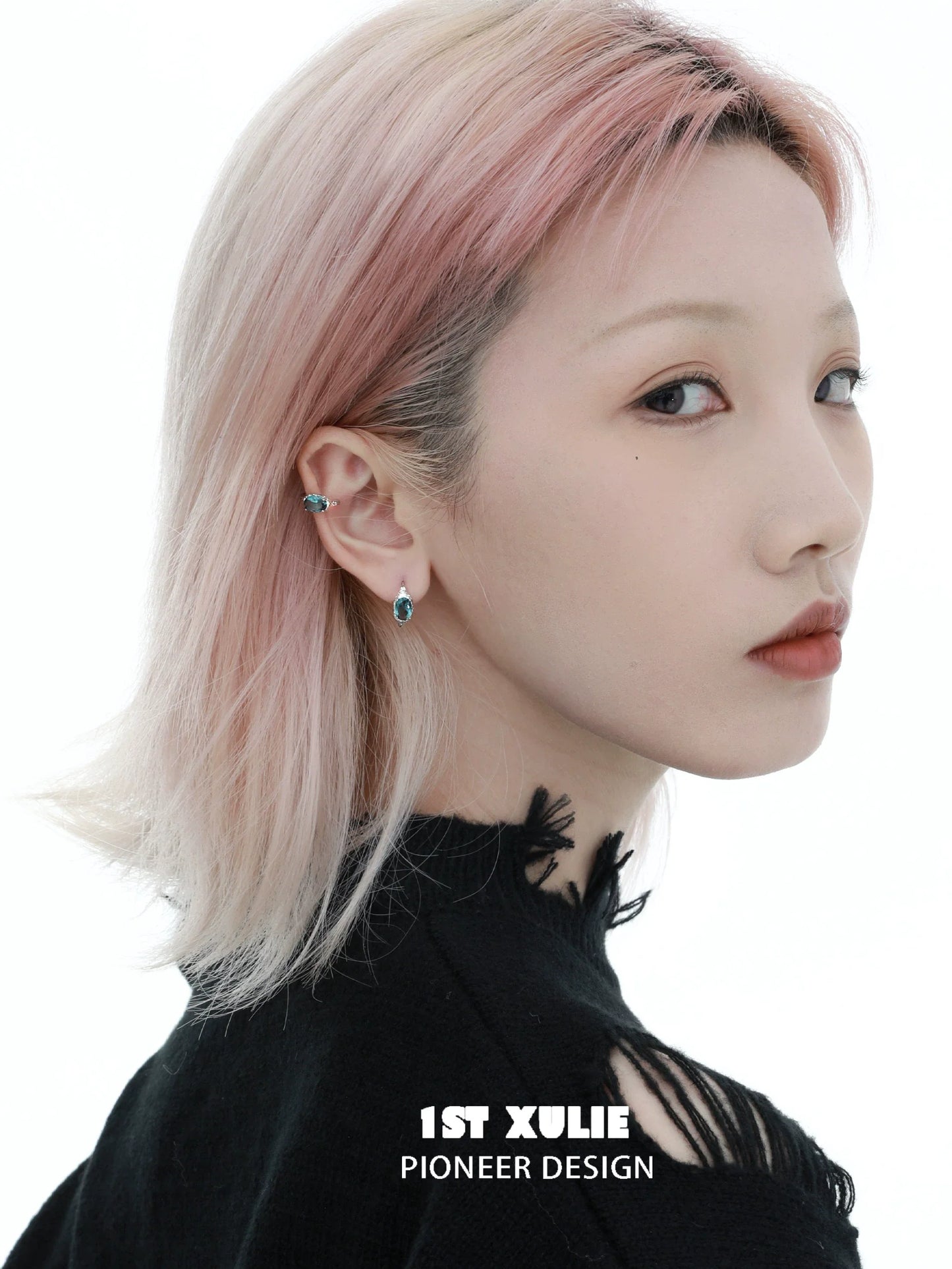 Model wearing Icelandic zircon ear cuffs that add a unique touch to her hairstyle and outfit