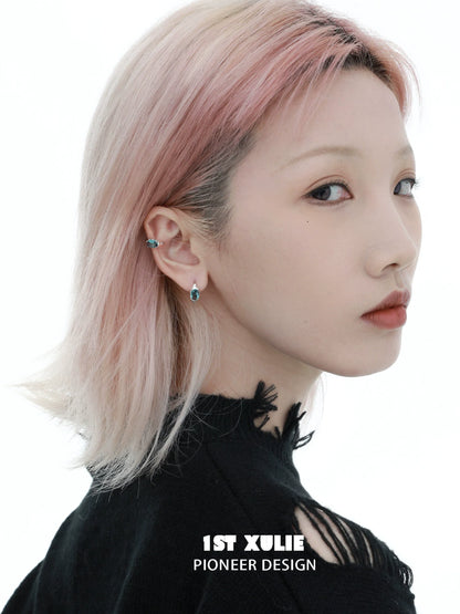 Model wearing Icelandic zircon ear cuffs that add a unique touch to her hairstyle and outfit