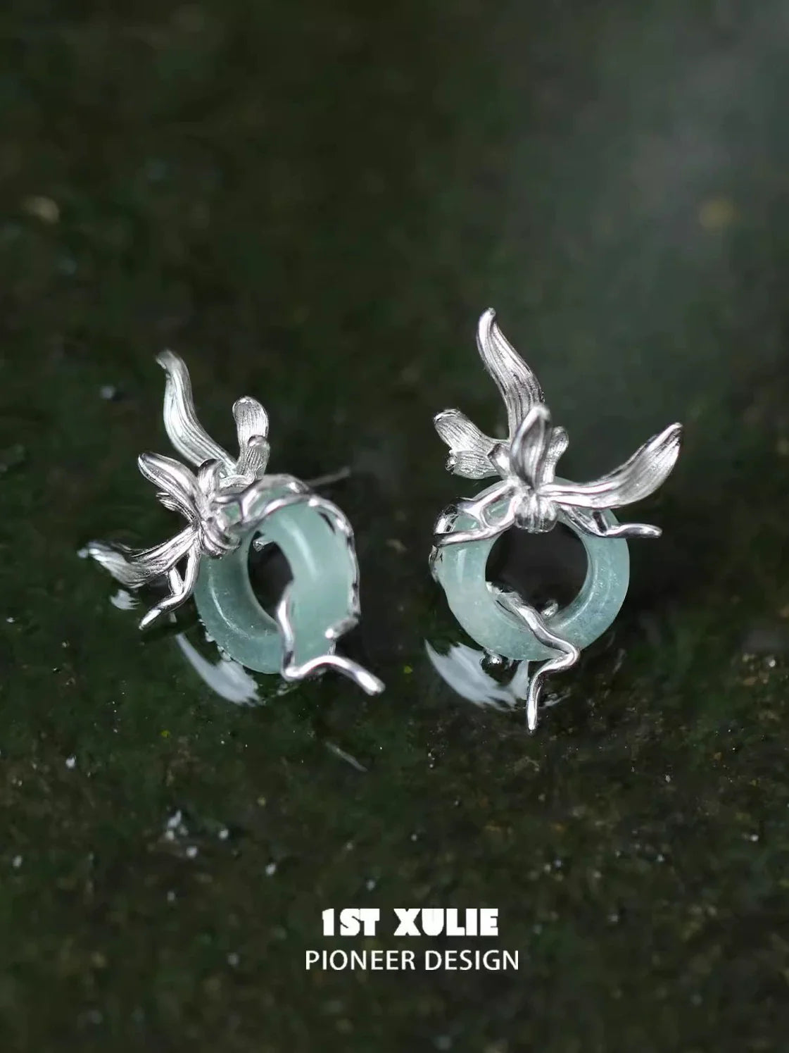 Iris silver stud earrings featuring a delicate floral design on a translucent stone base