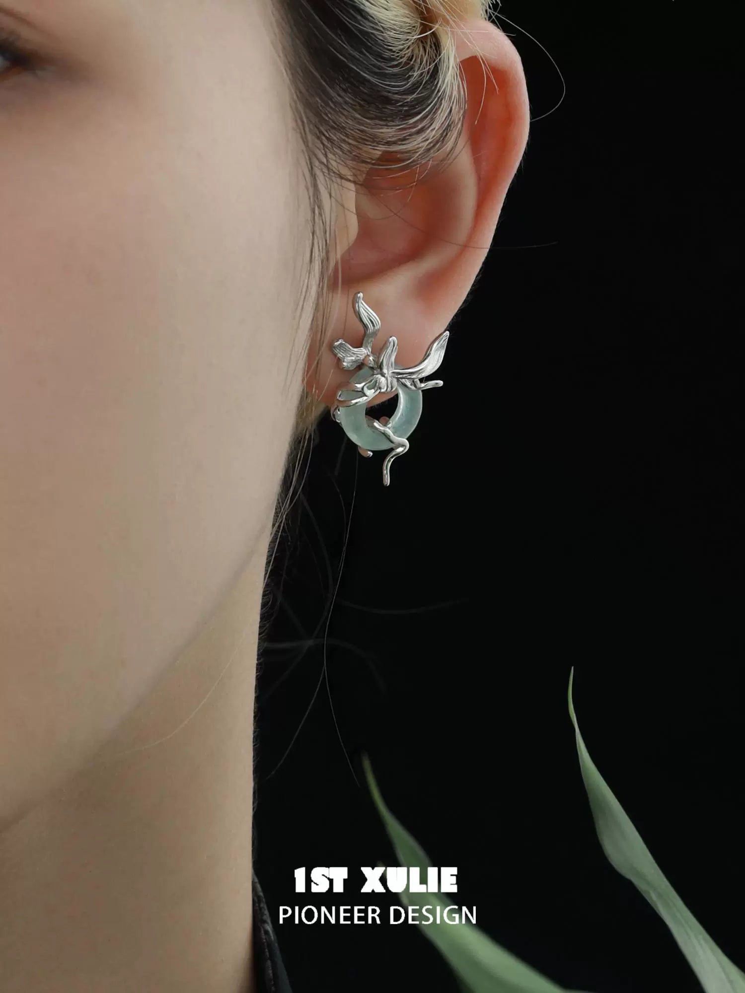 Iris silver stud earrings with a unique design featuring elegant silver detailing