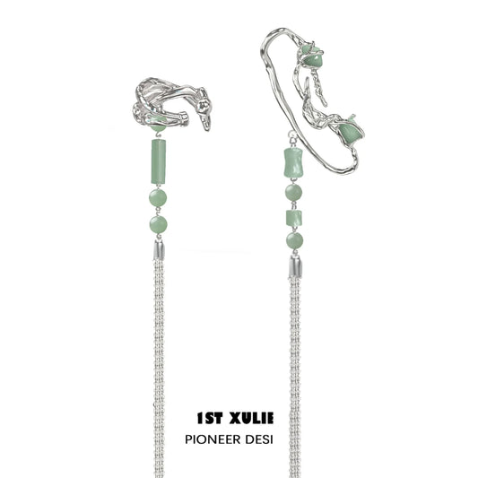 Elegant jade cascade ear clip featuring intricate silver details and delicate jade beads