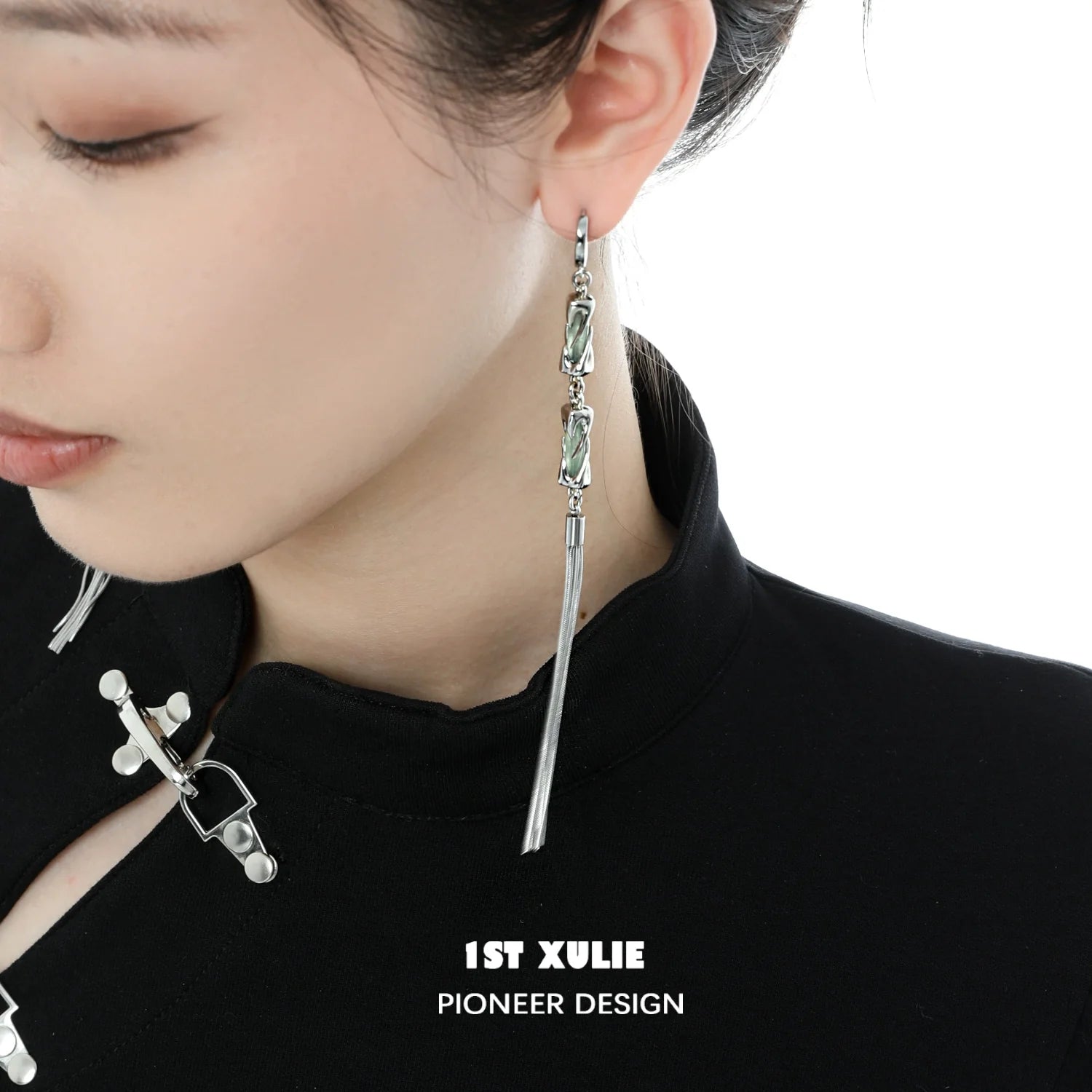 Elegant jade tassel earrings with a sleek silver design, perfect for stylish outfits