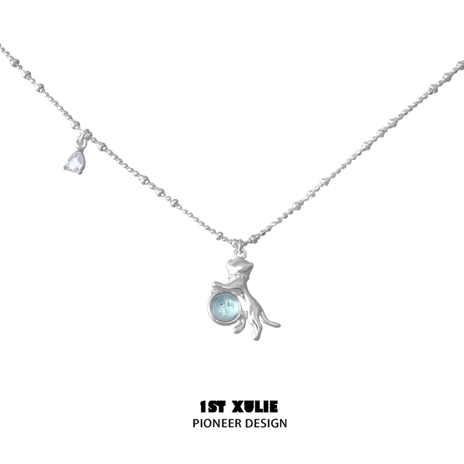 1ST XULIE kitten silver necklace featuring a playful kitten design and a blue gemstone accent