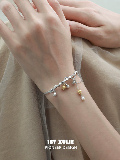 Elegant 1STXULIE lily of the valley bracelet featuring charms and delicate silver design