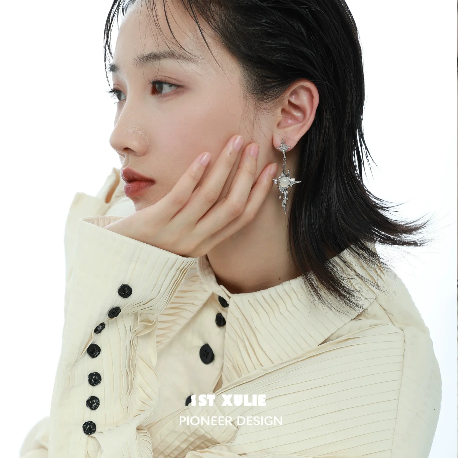 Stylish model wearing luminous agate cross earrings that shimmer elegantly, perfect for any occasion