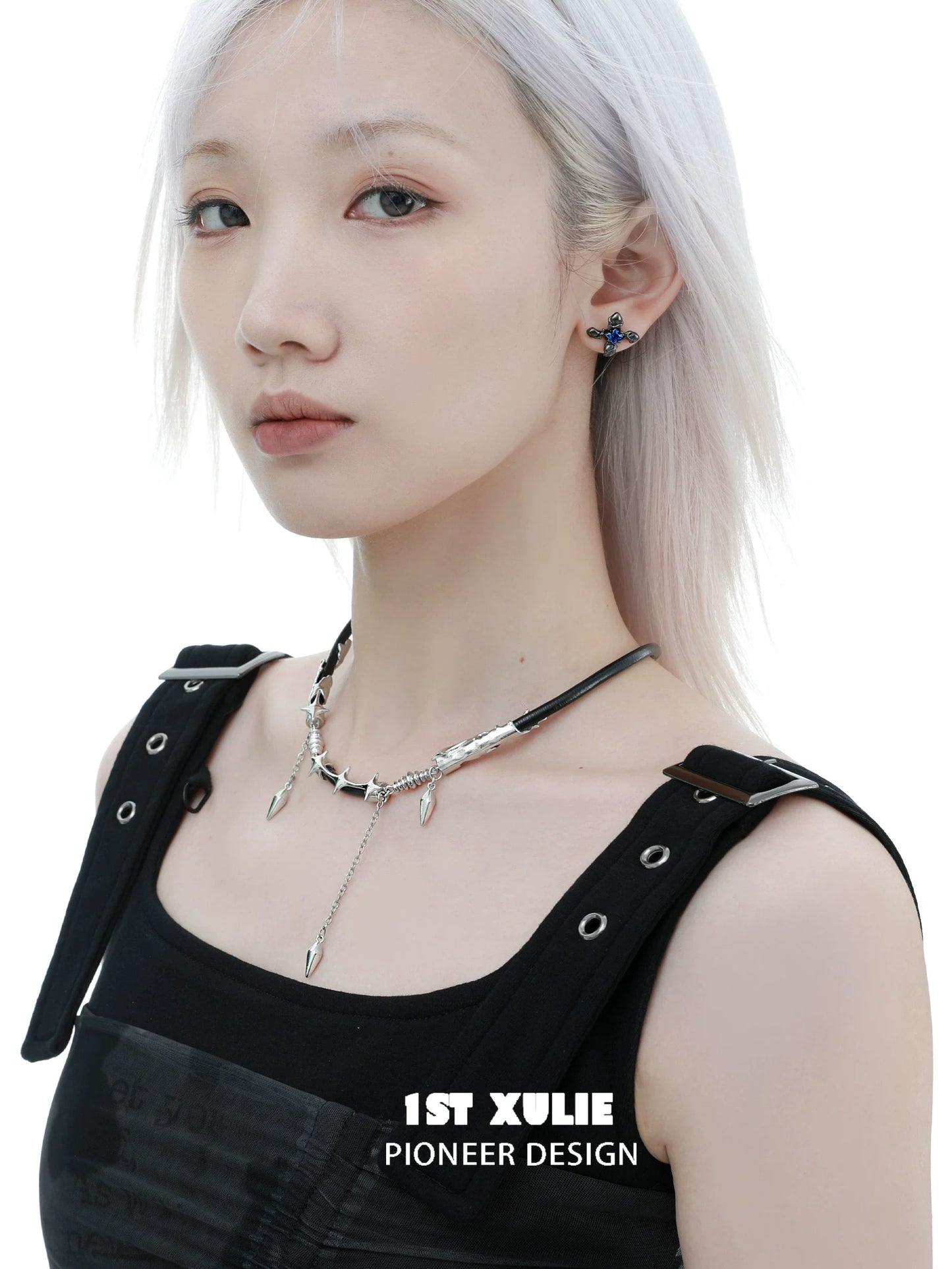 Model wearing a midnight talisman leather necklace featuring unique silver accents and a modern design