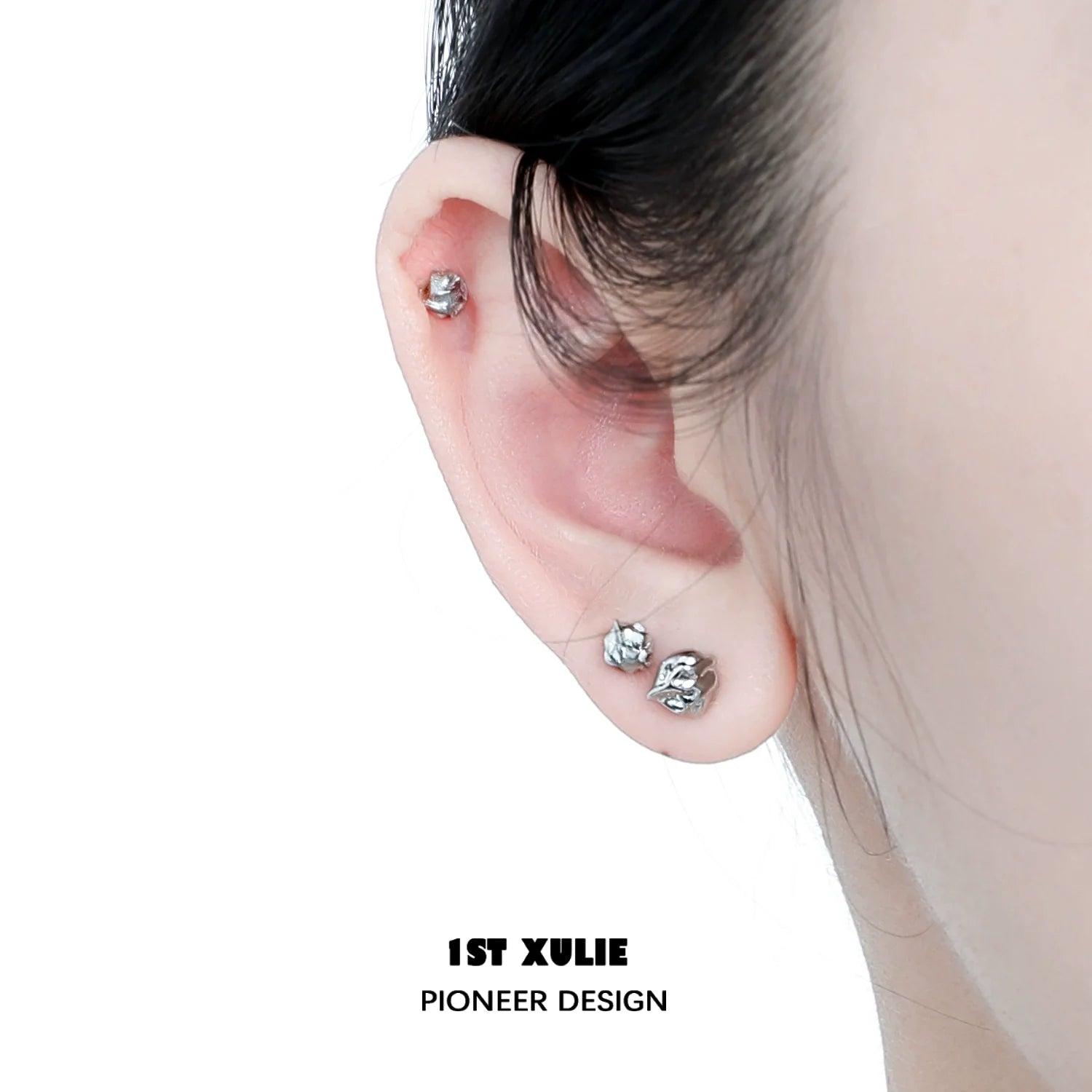 Minimalist bell echo earrings showcased on a model's ear, featuring a sleek and modern design