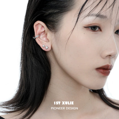 Minimalist bell echo earrings displayed on a model highlighting their elegant design and shine