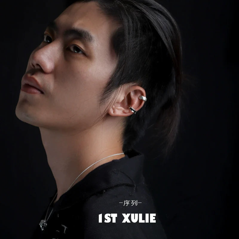 Minimalist frosted ear cuffs showcased on a model with a sleek hairstyle and a simple outfit