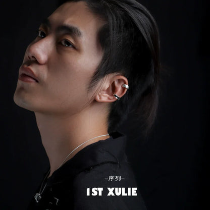 Minimalist frosted ear cuffs showcased on a model with a sleek hairstyle and a simple outfit